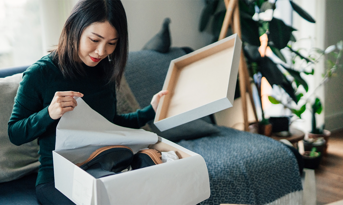 woman-opening-shopping-purchases-1122x671